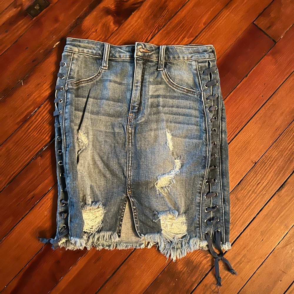 Fashion Nova denim distressed skirt w tied detailing on sides, size M